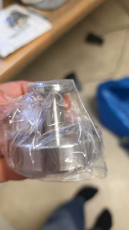 Brushed silver suction hook still in its protective wrapping