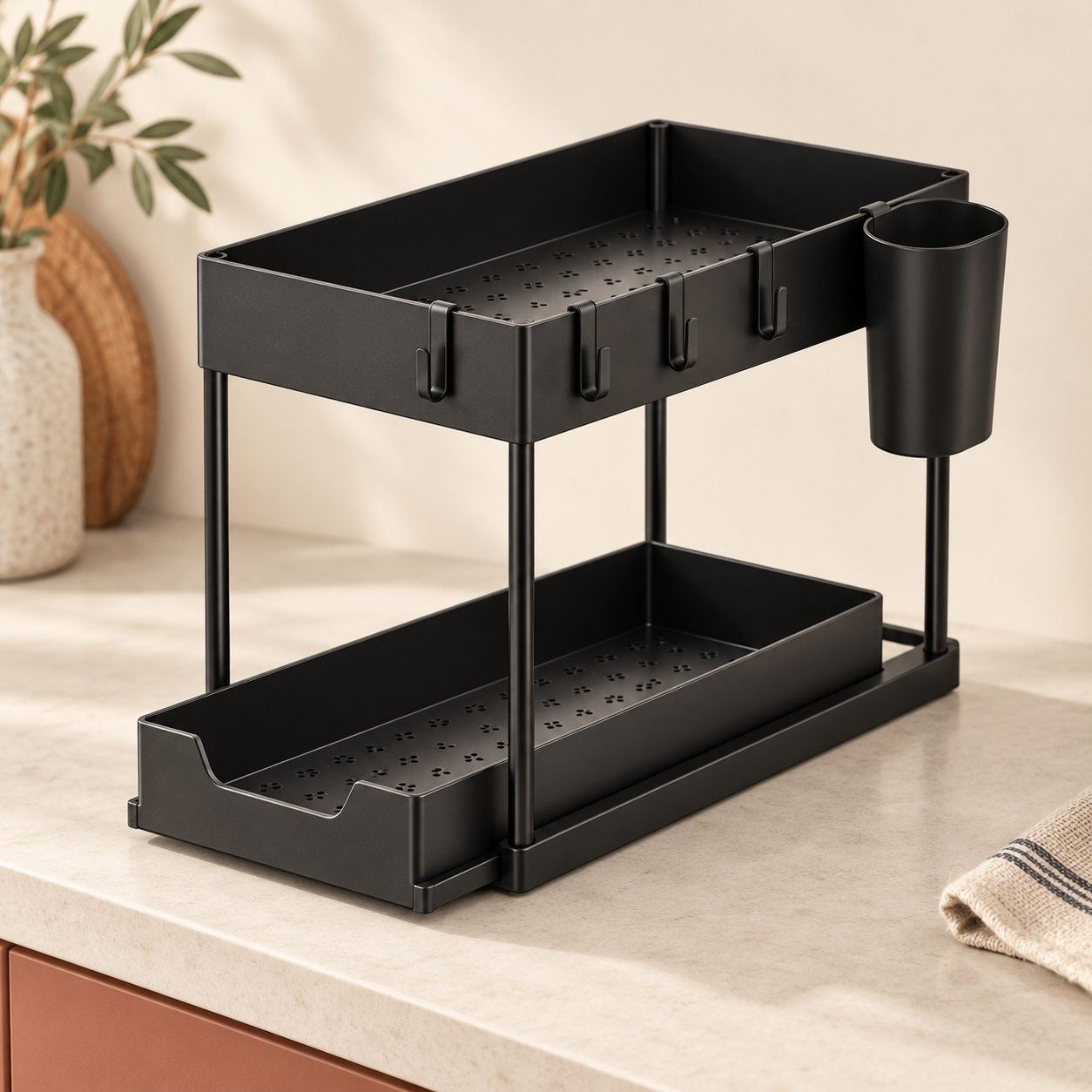 The Pull Out Under Sink Organiser showing its two tiers, side hooks and hanging cup