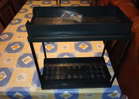 Pull out organiser shown assembled on a table